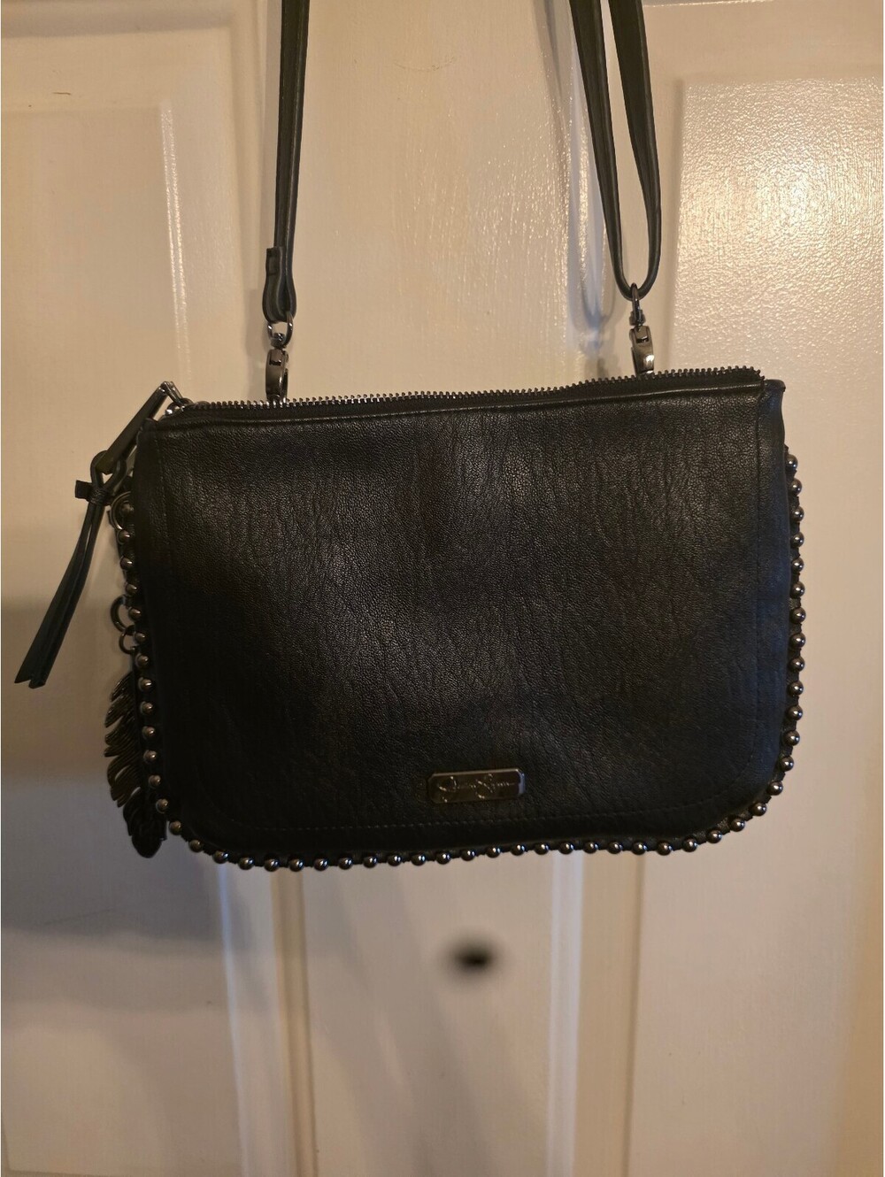 Jessica Simpson Black Crossbody Bag with Studded Trim and Animal Print Lining